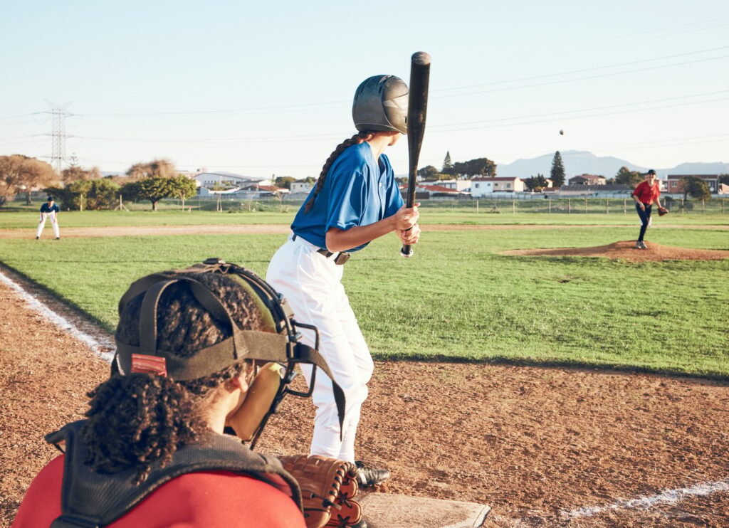 Baseball player, bat and outdoor on a pitch for sports, performance and competition. Professional a